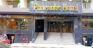a store with stairs leading to the entrance to a store at Pharaohs Hotel in Cairo