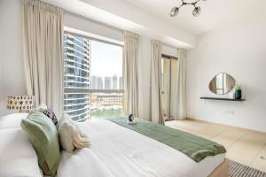 Postel nebo postele na pokoji v ubytování GuestReady - Luxurious Marina view residence