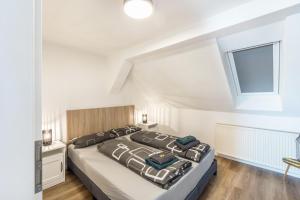 a bedroom with a large bed and a window at Eichendorff Loft in Nordhausen