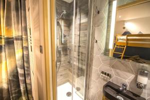a bathroom with a shower and a sink at Stylish place-Amazing Views-3 main lifts, Apt design- vue splendide-3 Telecabines in Samoëns +37 photos