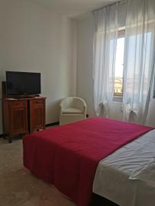 Et tv og/eller underholdning på Cenerina Home Due Mari + 11 billeder