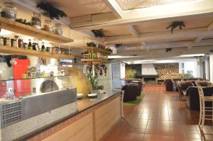 a restaurant with a bar and a dining room at Persey Flora Apartments in Borovets