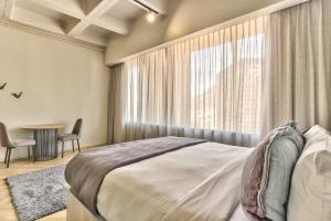 Postel nebo postele na pokoji v ubytování WINK Aparthotel One Thibault