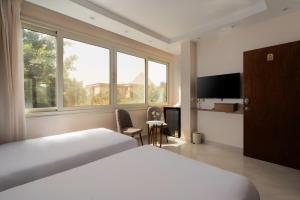 Postel nebo postele na pokoji v ubytování Dream Inn Pyramids View