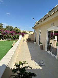 a balcony of a house with a garden at La Stella dei Venti in Porto Empedocle