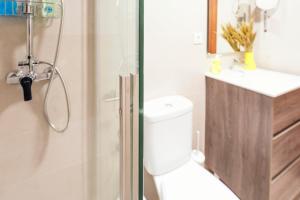 a bathroom with a shower and a toilet and a sink at Summerlandrota Veracruz28 in Rota