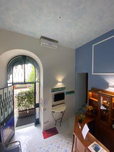 Televízia a/alebo spoločenská miestnosť v ubytovaní Rental House Angelina
