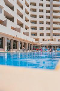 a large swimming pool in front of a building at Port Europa in Calpe