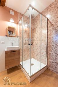 a shower with a glass enclosure in a bathroom at Chez Hansi & Emmy - Gueberschwihr in Gueberschwihr +70 photos
