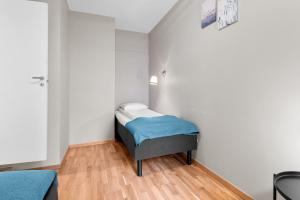 a small room with a small bed in the corner at Forenom Serviced Apartments Oslo Nobel in Oslo