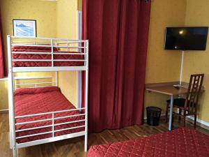 Postel nebo postele na pokoji v ubytování Hotel Saint-Aignan