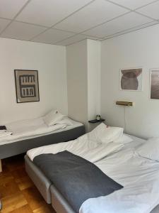 Katil atau katil-katil dalam bilik di Ewa & Maude Hotel Aston Villa