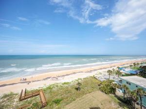 a view of a beach with people in the ocean at Sea Winds 602 in Ormond Beach