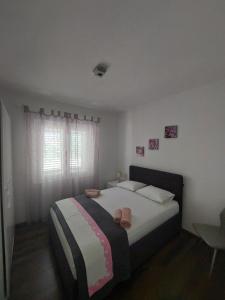 Postel nebo postele na pokoji v ubytování Apartman Nora