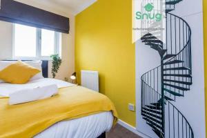 a yellow bedroom with a spiral staircase next to a bed at Hardwick House 3 bed with parking for Contractors & Tourists in Gateshead