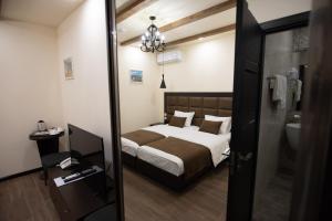 Voodi või voodid majutusasutuse Boutique Living Hotel toas