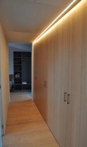 a hallway with wooden cabinets in a room at Boutique Hotel La Rocca in Ronco s/Ascona - Porto Ronco