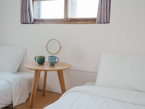 Letto o letti in una camera di 東衛參捌 陶藝旅店