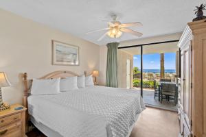 a bedroom with a bed and a ceiling fan at Bluewater Unit 104 in Orange Beach