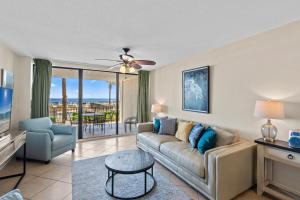 a living room with a couch and a table at Bluewater Unit 104 in Orange Beach