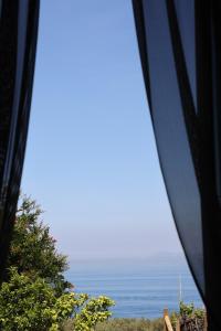 a view of the ocean from a train window at Villa Puolo - With Private Sea Access in Sorrento