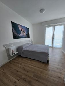 Postel nebo postele na pokoji v ubytování Via San Zeno Home + 35 fotografií