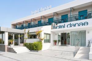 a facade of a hotel dmg with a sign on it at Danae Hotel in Egina