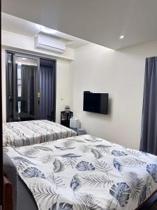 Kama o mga kama sa kuwarto sa Yun B&B