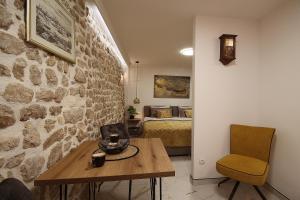 Postel nebo postele na pokoji v ubytování Apartman in Centar Studio MOZZIRA Free breakfast