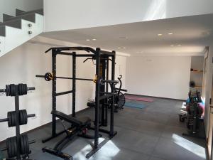 a gym with treadmills and weights in a room at Hotel Club Sunway Punta Prima in Es Pujols