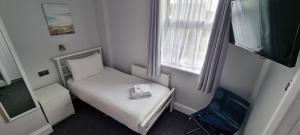 Postel nebo postele na pokoji v ubytování Medehamstede Hotel