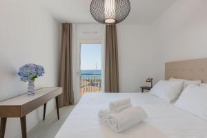 Postel nebo postele na pokoji v ubytování Portopiccolo Apartments + 265 fotografií