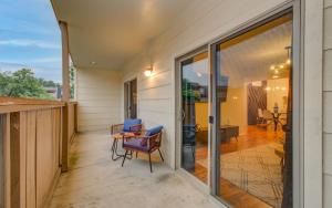 a balcony with a table and chairs on a house at 3 Bedrooms Spacious Central Condo w Pool in Houston