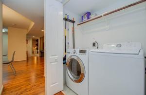 a white washer and dryer in a room at 3 Bedrooms Spacious Central Condo w Pool in Houston