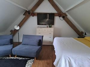 Een bed of bedden in een kamer bij La Jauchelle