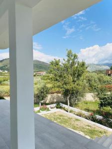 a view from the balcony of a house at Cozy Village Guesthouse in Delvinë