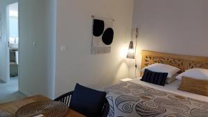 Postel nebo postele na pokoji v ubytování Le Clos de l'Aiguillon