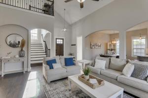 a living room with a couch and a table at Texan Sunny Oasis 5 BED Private Pool Hot tub in Rowlett +41 photos