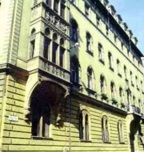 a building with a clock tower on top of it at Imre Guest House in Budapest