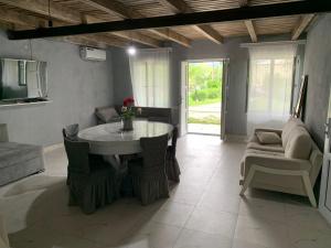 a living room with a table and a couch at hotel pillows in Martvili