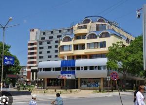 a large building on the corner of a city street at апартамент CITY HOME 22 in Yambol