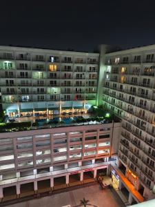 a view of a large apartment building at night at 4 Season hotel in Lucknow