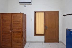 Fotografija v galeriji nastanitve Reddoorz at Griya Kampar Madiun v mestu Madiun