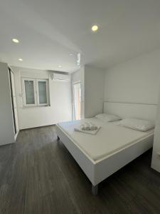 Postel nebo postele na pokoji v ubytování Apartments Vinko
