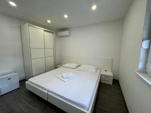 Postel nebo postele na pokoji v ubytování Apartments Vinko
