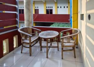 Predel za sedenje v nastanitvi Reddoorz at Griya Kampar Madiun
