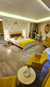 Postel nebo postele na pokoji v ubytování Grand Hotel Baroc