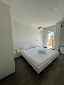 Postel nebo postele na pokoji v ubytování Apartments Vinko