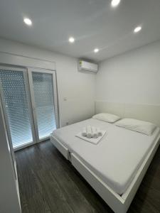 Postel nebo postele na pokoji v ubytování Apartments Vinko