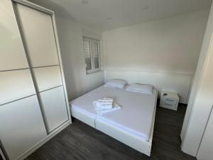 Postel nebo postele na pokoji v ubytování Apartments Vinko
